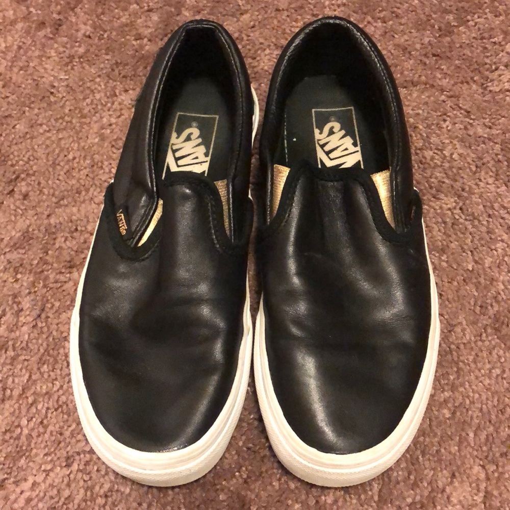 Black leather Vans slip ons